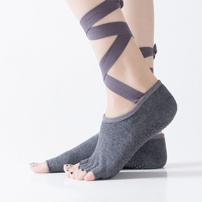 Women's elastic non-slip training socks with open toes and ties, perfect for yoga, showing secure finger-separated design and comfortable fit.