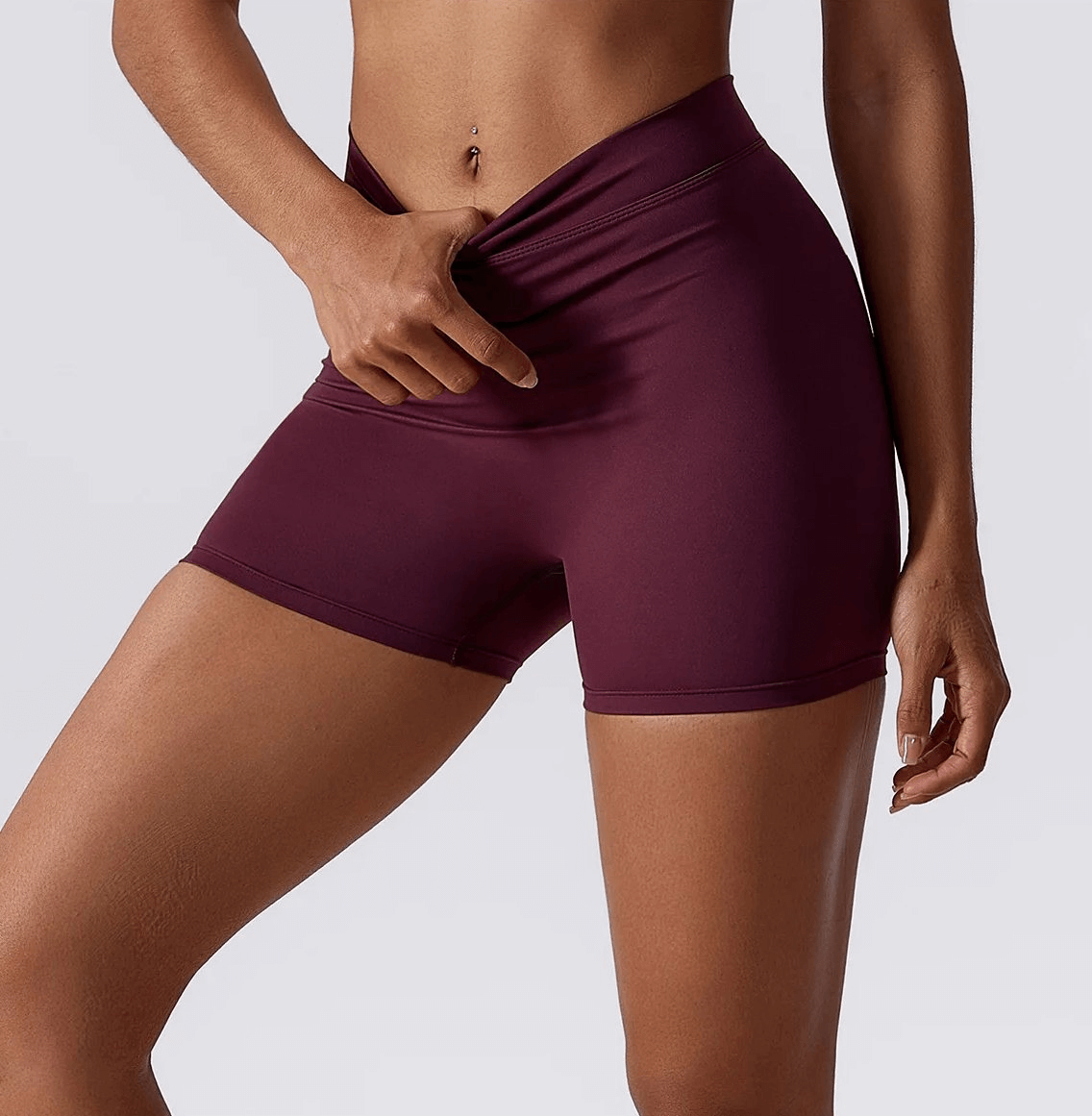 Women's elastic performance yoga shorts in maroon, perfect for fitness, running, and sports. Durable, stylish, and flexible.