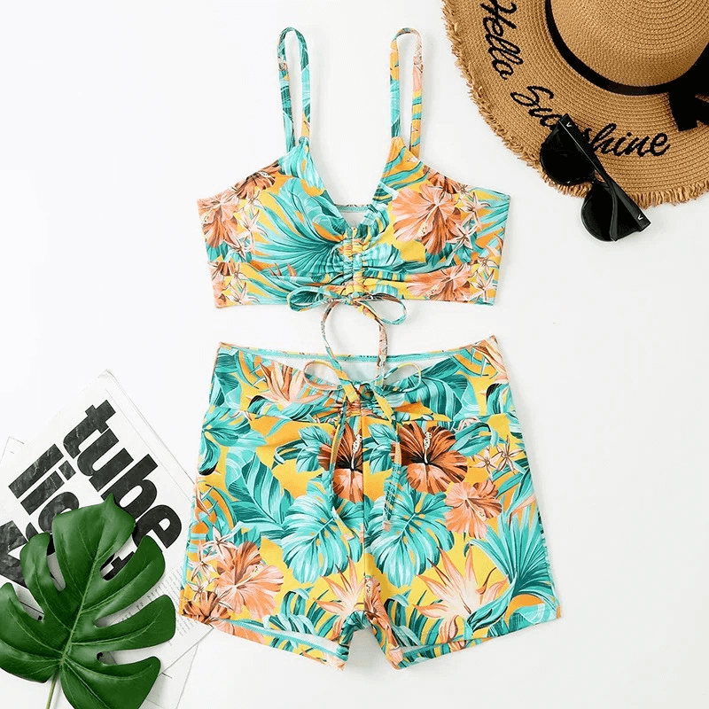 Women's two-piece floral swimsuit SF1866, featuring vibrant flower prints, straps, and tropical style. Ideal for summer swimwear.
