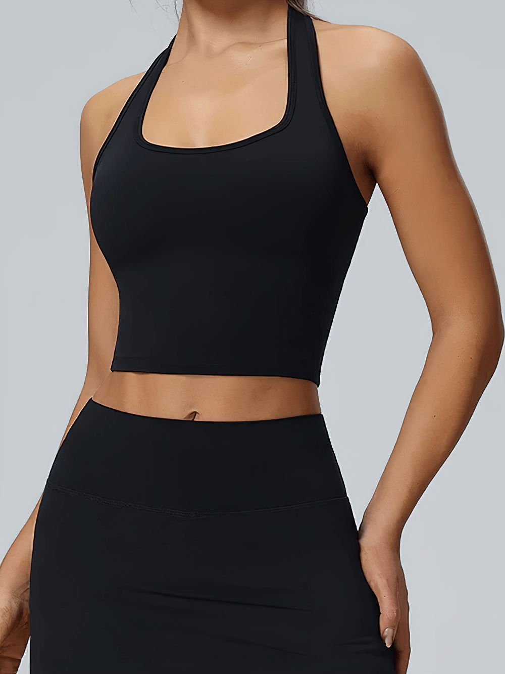 Alt Tag: Women's Halter Yoga Crop Top for Gym and Training - SF4423 black backless sleeveless crop tank with open back, stretch fit, paired with leggings
