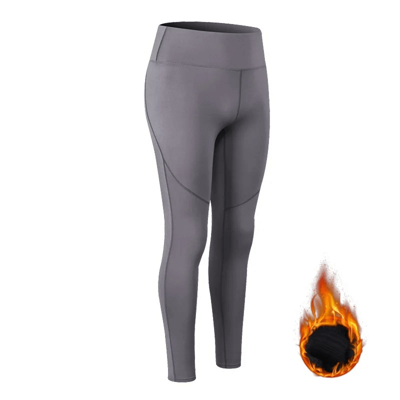 Women's High Waist Insulated Yoga Leggings in gray, featuring a full-length design and elastic waist for warm, stretchable comfort.