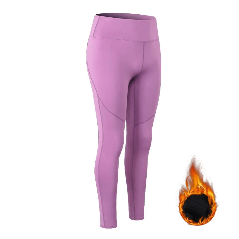 Purple high waist insulated yoga leggings designed for warmth and comfort, with fire icon indicating heat-retaining fabric.