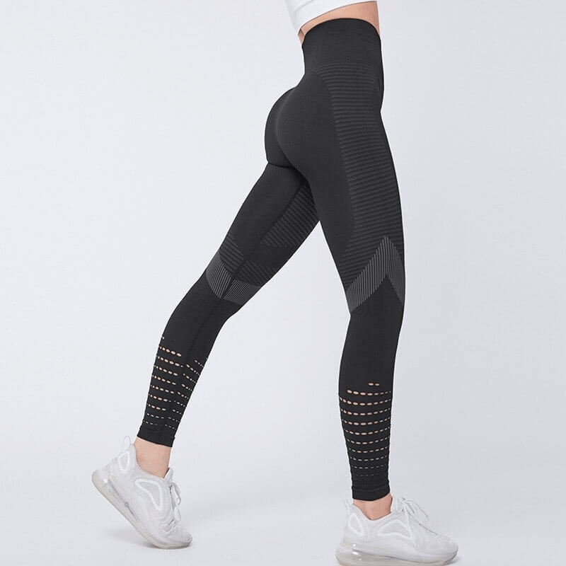 Women's hollow seamless high-waisted fitness leggings SF0184, black, featuring breathable fabric and booty-lifting design for comfort.