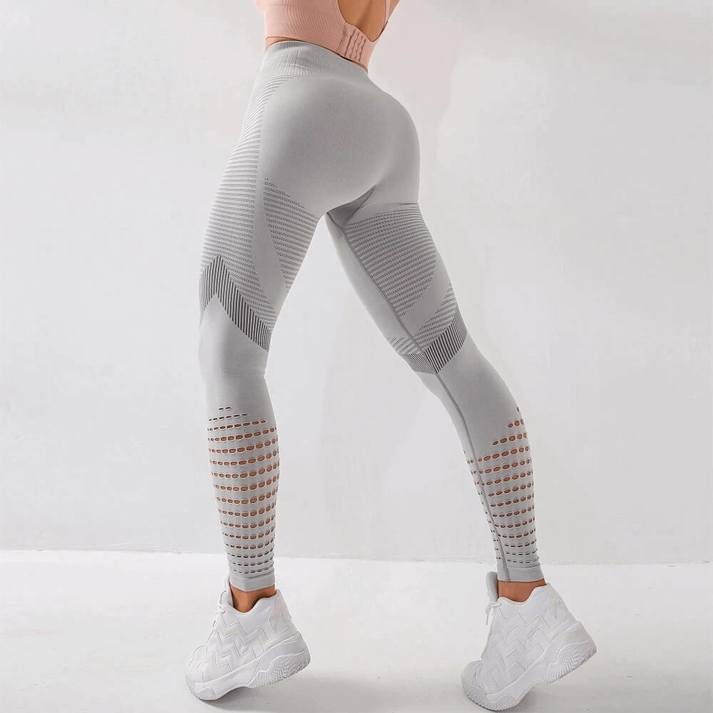 Women's hollow seamless high-waisted leggings for fitness with breathable fabric and booty-lifting design, perfect for workouts.