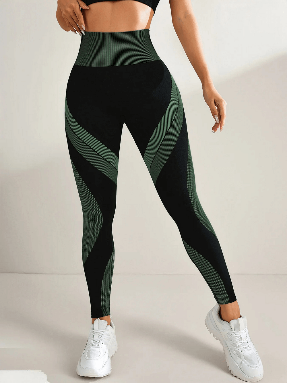 Woman wearing Women's Leggings with Scrunch Butt Lifting - SF4038 in stylish black and green design, standing against a neutral background.
