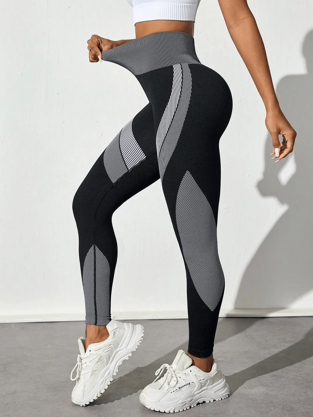 Model wearing Women's Leggings with Scrunch Butt Lifting - SF4038, showcasing stylish high-waisted design with sneakers.