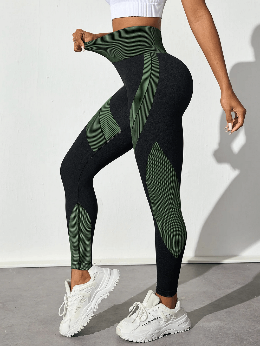 Side view of Women's Leggings with Scrunch Butt Lifting - SF4038 in black and green, worn with white sneakers.