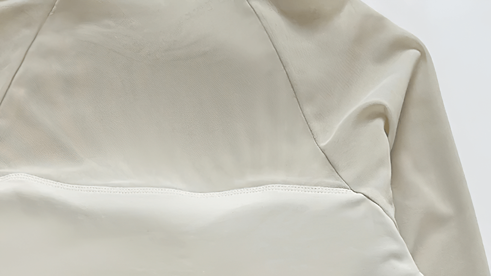 Close-up of Women's Long-Sleeved Crop Top with Breathable Fabric - SF4176 in beige, showcasing sleek design and premium nylon material.