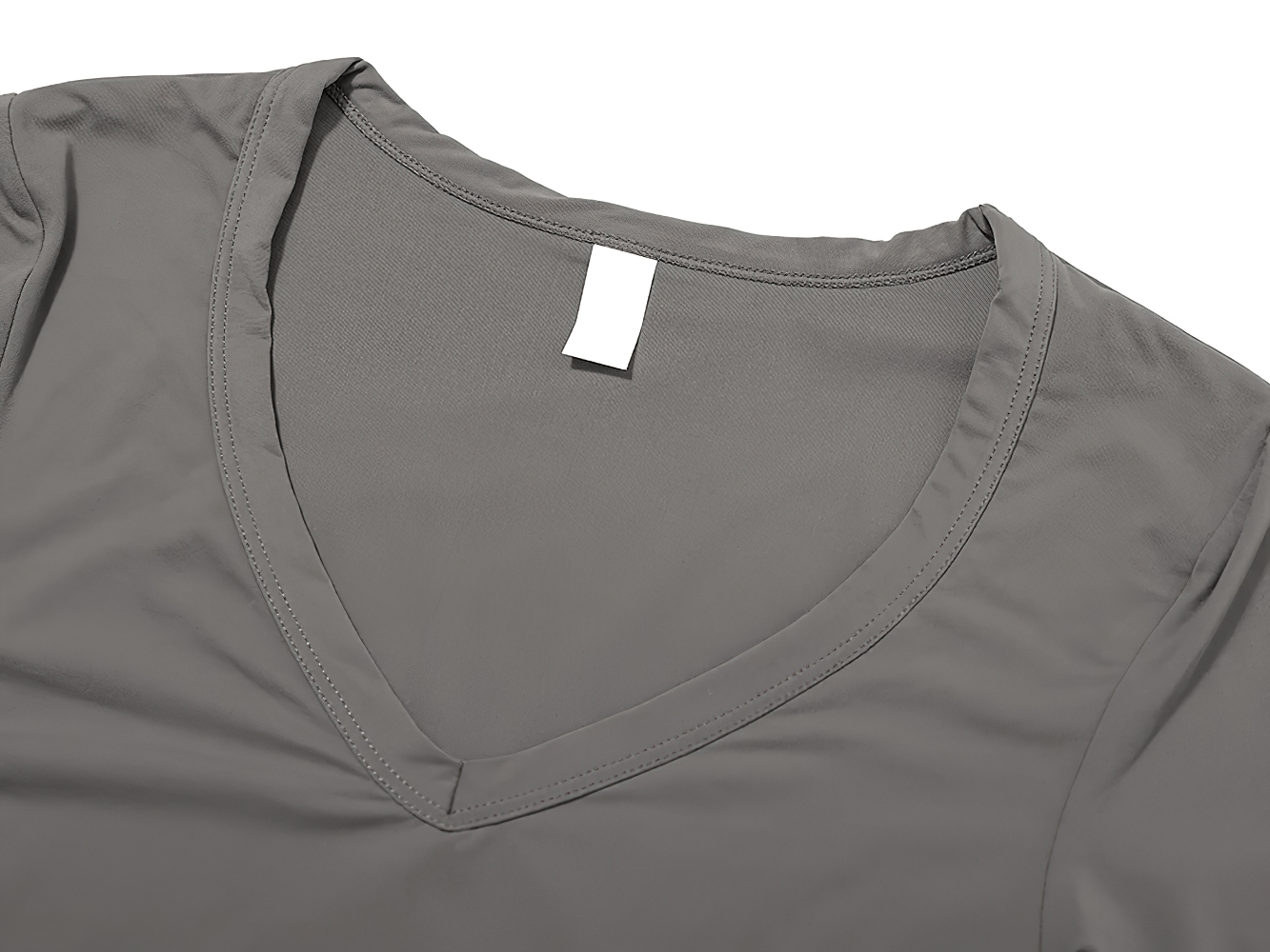 Women's long-sleeved quick-dry yoga crop top in gray with a sleek V-neck design, made from breathable nylon and spandex for workouts.