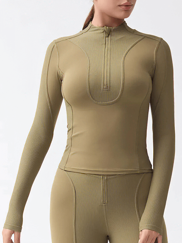Women's long-sleeved solid top with half zipper in olive green, breathable nylon fabric, perfect for cold weather activities.