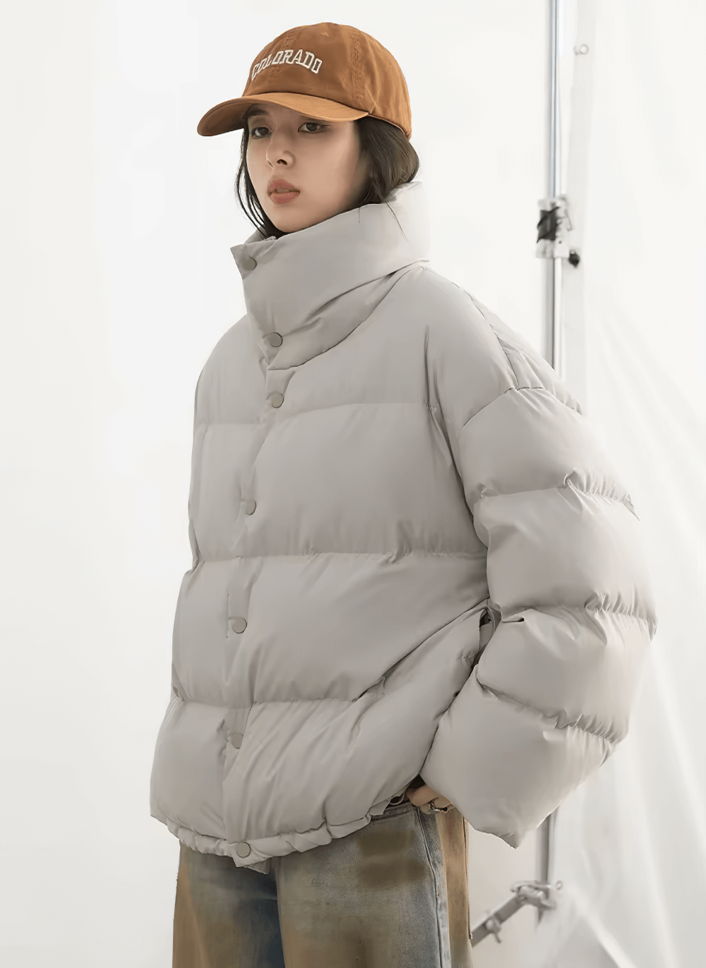 Women's loose stand collar duck down winter jacket in gray, stylish and warm, perfect for casual winter style.