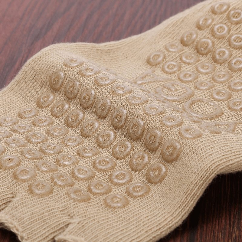 Close-up of non-slip grip pattern on women's five-toe yoga socks for enhanced stability and comfort during practice.