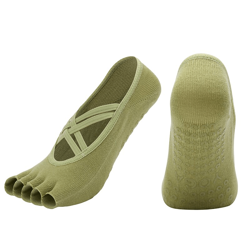 Women's non-slip breathable five-toe yoga bandage socks in green, showing top and sole views for comfort and grip.