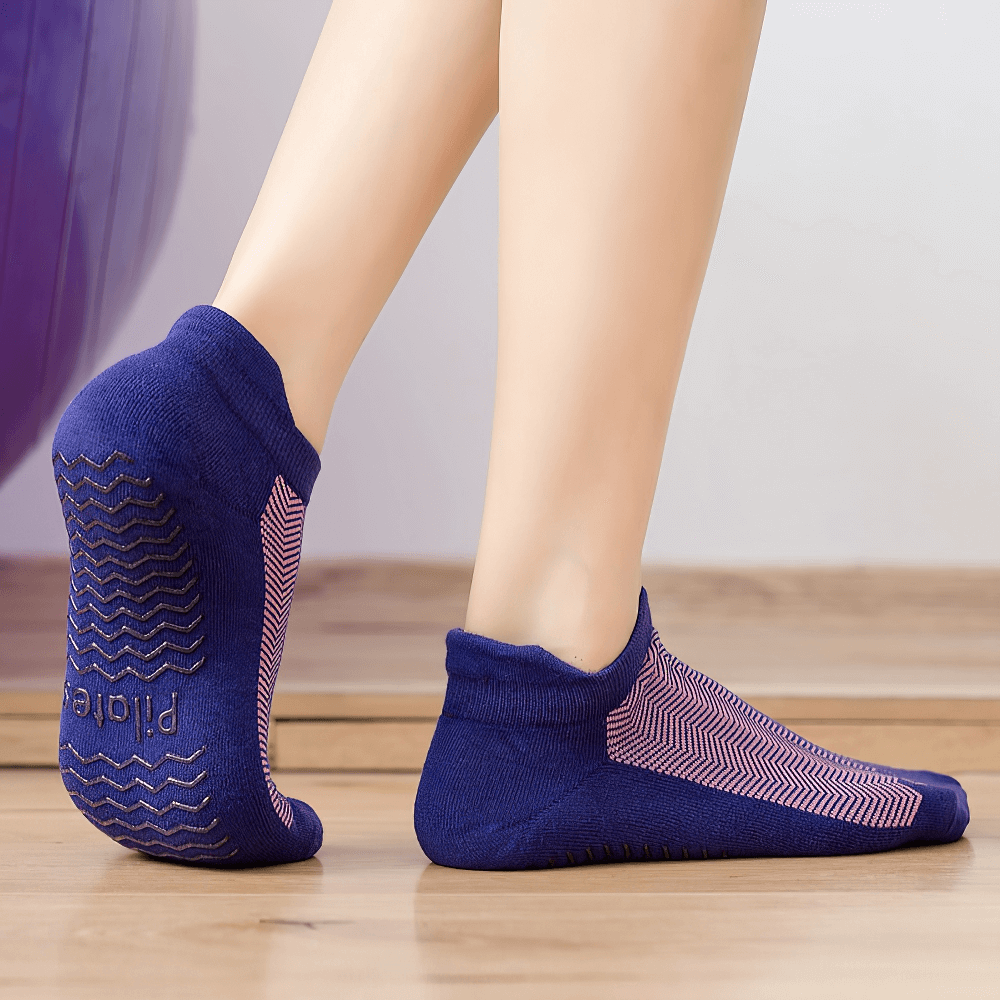 Women's non-slip breathable pilates socks in blue, showing anti-pilling grip and comfort for yoga and dance.