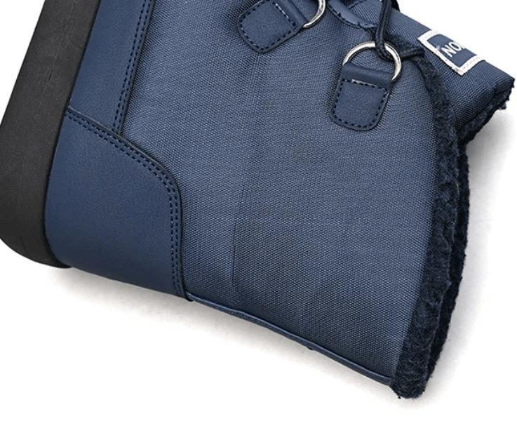 Close-up of the blue women's non-slip insulated waterproof hiking boots with lace-up closure and rubber outsole.