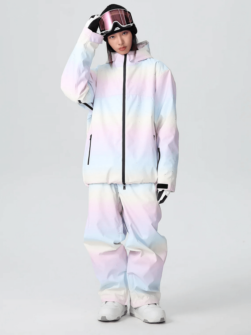 Woman wearing a pastel snowboard outfit, perfect for trendy slopes; includes waterproof, breathable jacket and pants with cotton padding.