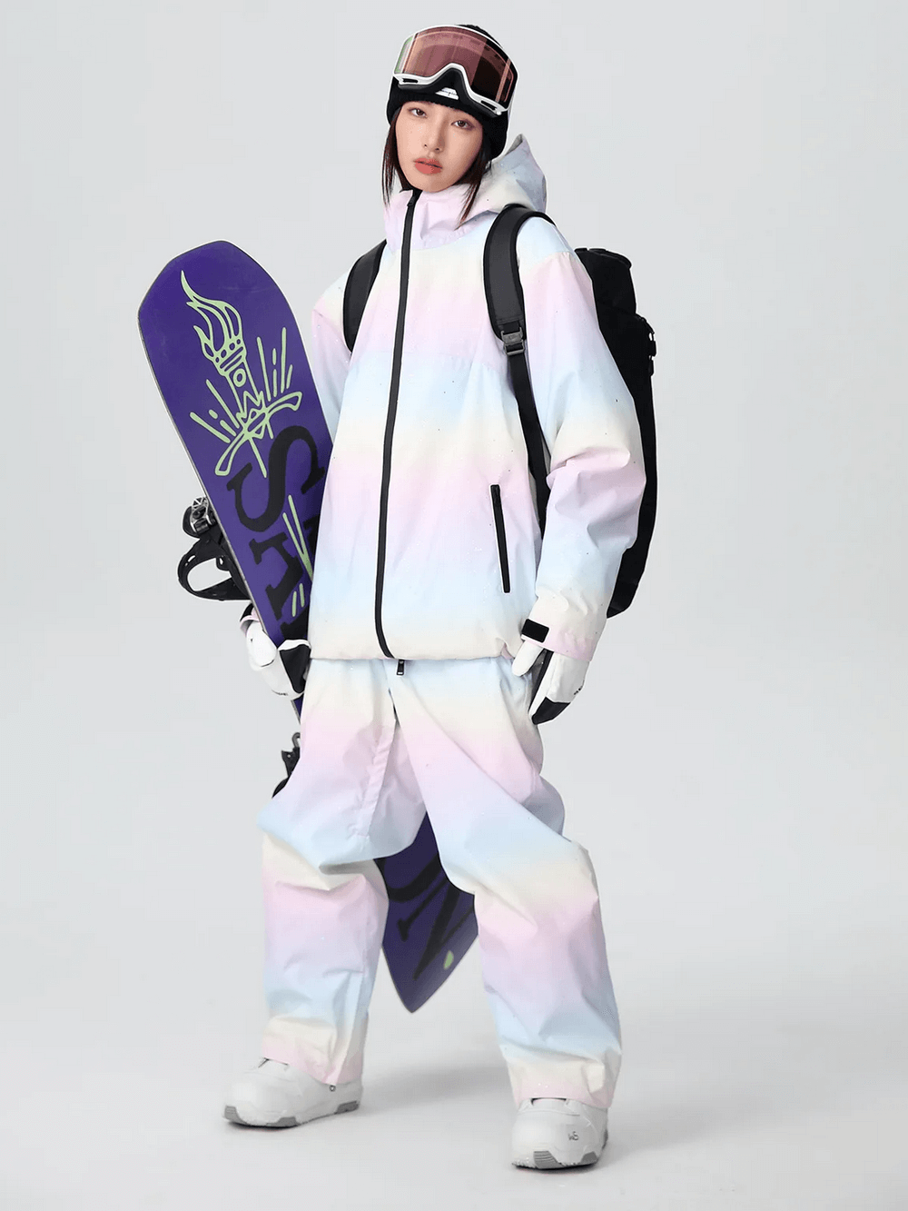 Trendy woman in pastel snowboard outfit holding a purple snowboard, ready for the slopes with sleek and stylish snow gear.