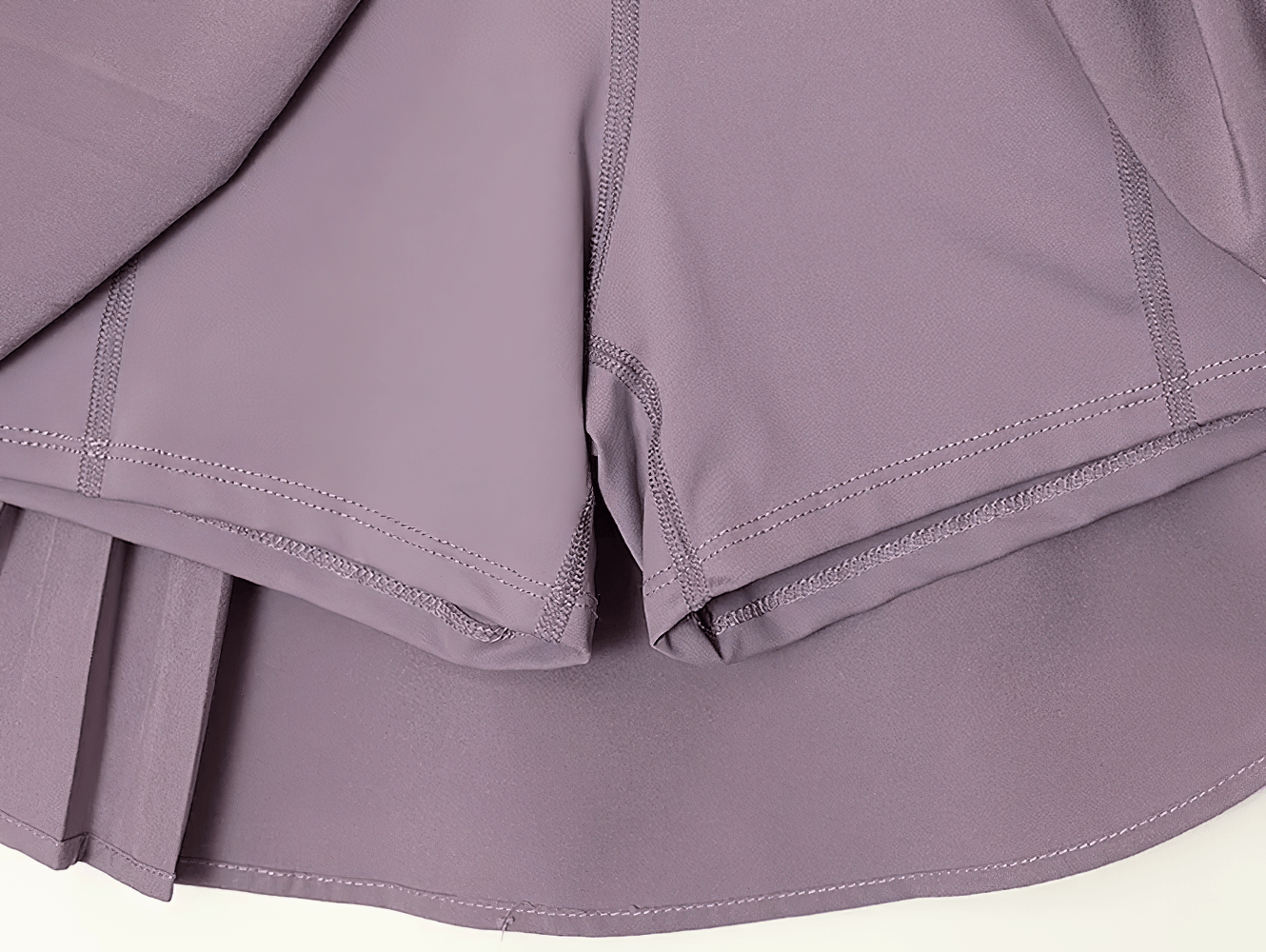 Women's Pleated Sports Skort With Hidden Shorts - SF4571, featuring a stylish pleated hem and hidden shorts for comfort.