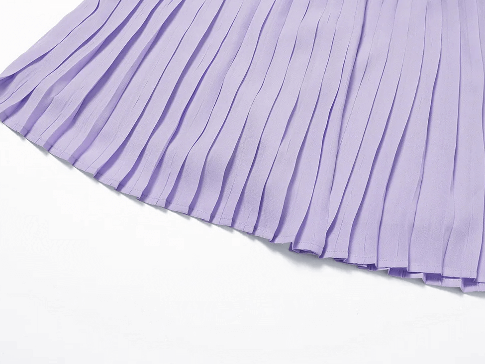 Close-up of a lavender pleated tennis skirt with elegant detailing, perfect for athletic wear and stylish court appearances.
