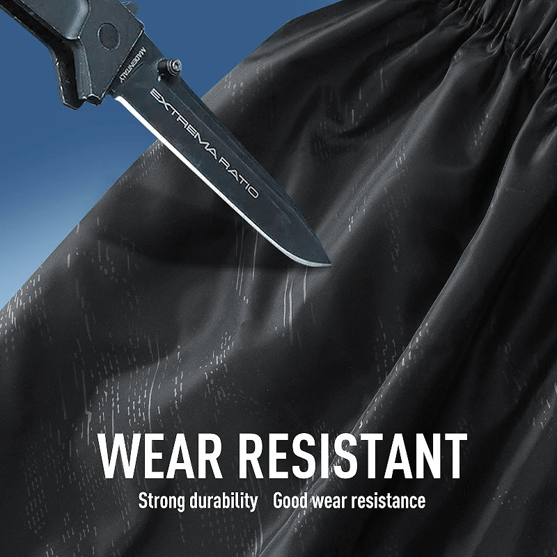 Knife test demonstrating wear-resistant black polyester fabric of women's track pants, highlighting durability and strength.