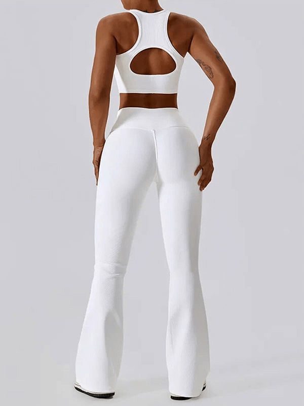 Back view of woman in white push-up sports bra and ribbed flare leggings, showcasing activewear for an active lifestyle.
