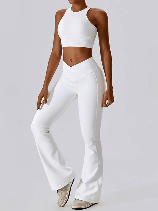 Woman in white push-up sports bra and ribbed cross leggings ready for active lifestyle.