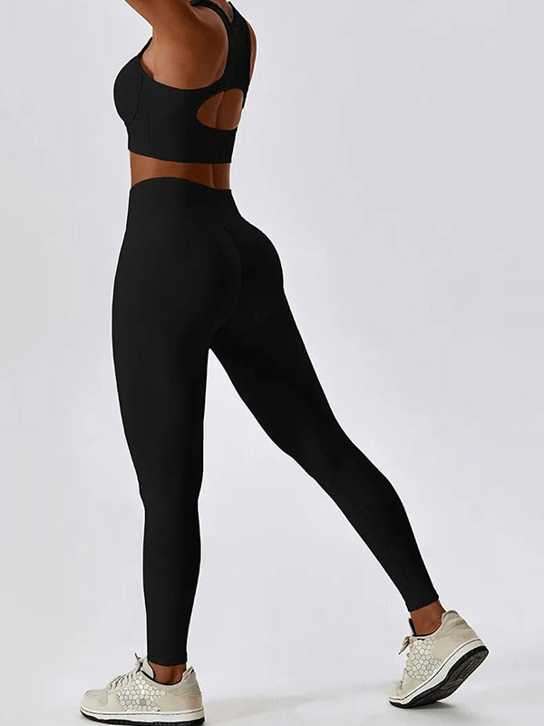 Back view of woman wearing a black push-up sports bra and ribbed cross leggings, perfect for workouts. SF1722 activewear set.