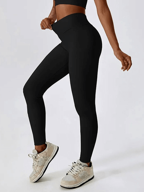 Model wearing black ribbed cross leggings with sneakers, showcasing the stretchy, quick-dry design perfect for an active lifestyle.