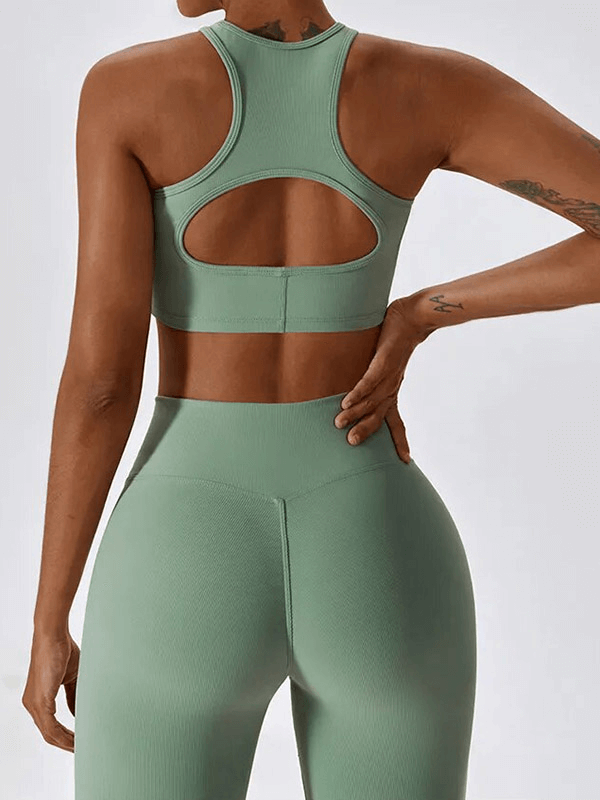 Rear view of a woman in a sage green push-up sports bra and ribbed cross leggings, perfect for active lifestyle, showcasing comfort and style.