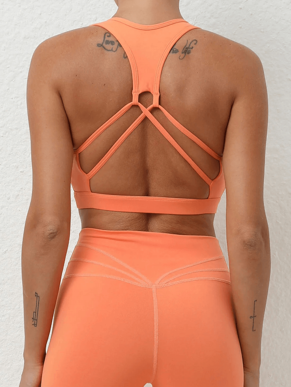 Alt Tag: Women's Push Up Sports Bra with Strappy Back Design - SF4425 peach strappy back sports bra for gym, running, yoga
