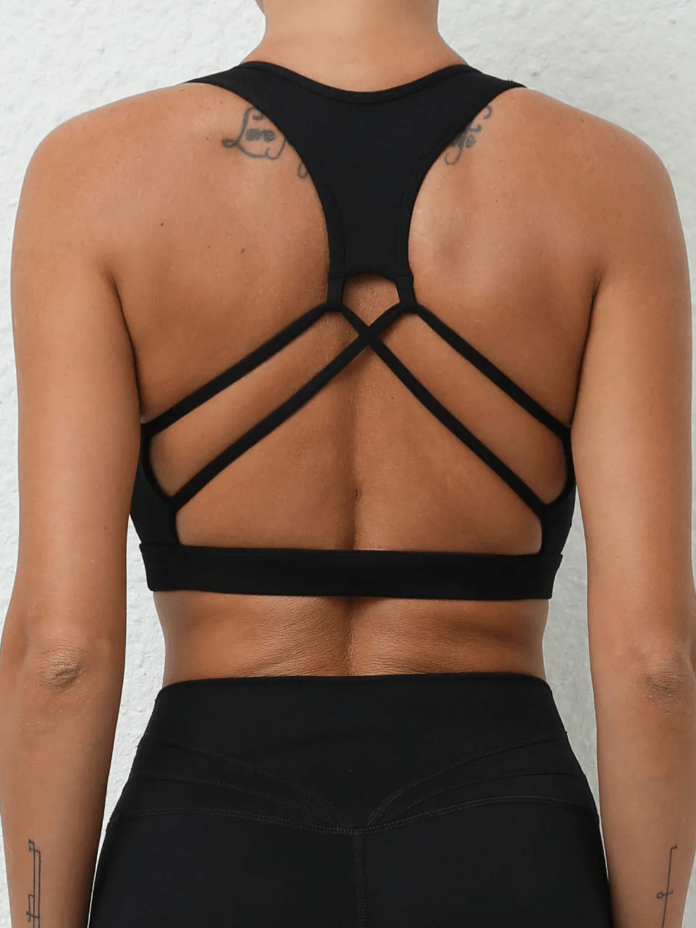 Alt Tag: Women's Push Up Sports Bra with Strappy Back Design - SF4425 black strappy back sports bra for running, gym training, yoga workout