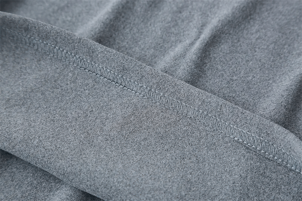 Alt Tag: Women's Quarter Zip Hooded Sport Hoodie - SF4536 grey fabric close-up with stitched seam detail, soft cotton-poly blend sporty hoodie