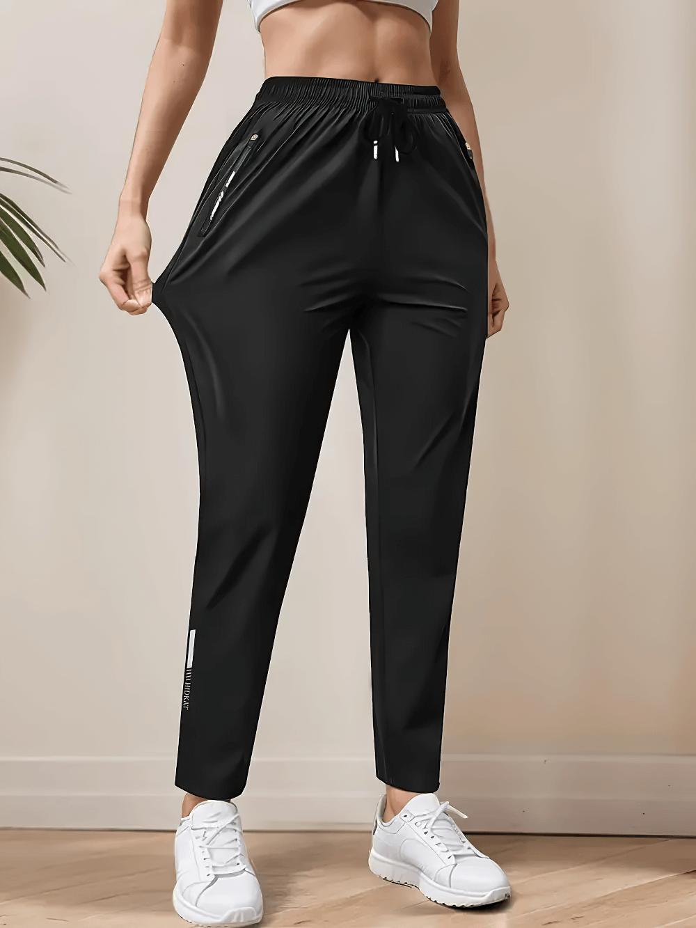 Alt Tag: Women's Quick-Dry Ankle Pants with Zip Pockets - SF4404 black tapered jogger pants with drawstring waist and zip pockets