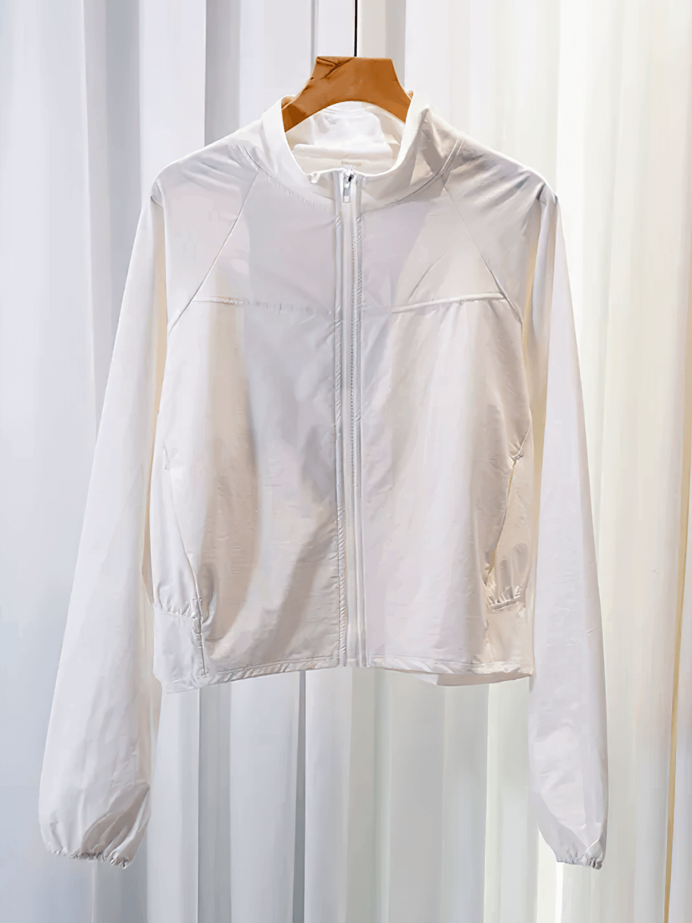 Women's Quick-Dry Running Windproof Zip Jacket - SF4083 hanging on a hanger showcasing its lightweight and sleek design.