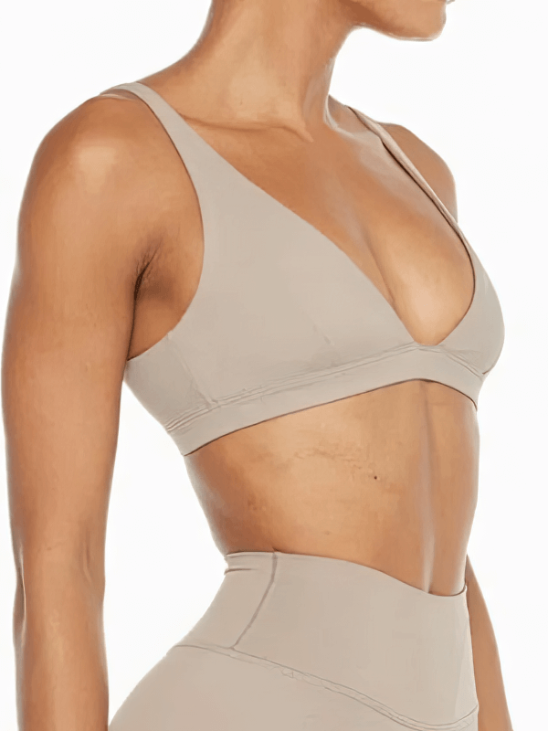Women's quick-drying sports bra with deep neckline in solid beige, perfect for yoga and active wear, breathable nylon, SF1758.