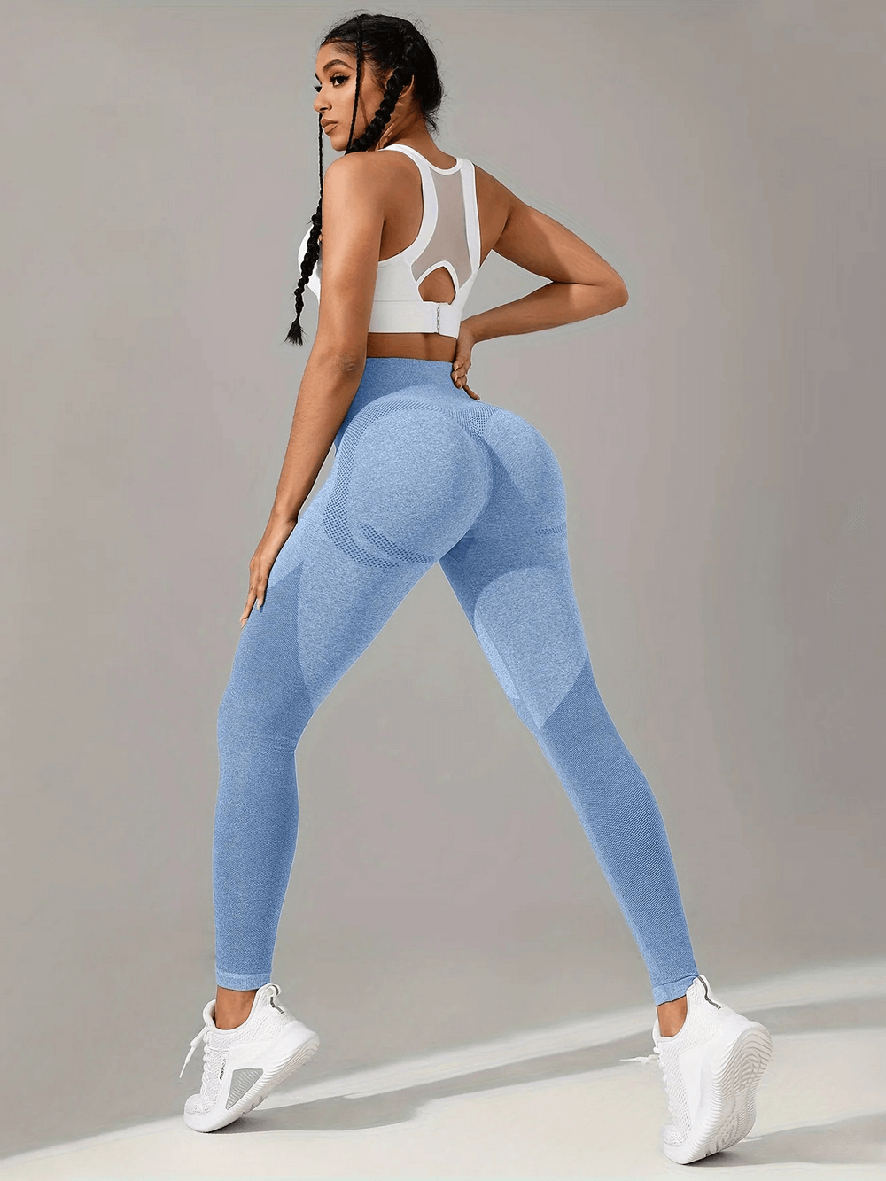 Woman wearing Women's Seamless Booty Lift Gym Leggings - SF4059 in light blue, showcasing squat proof fitness fashion.