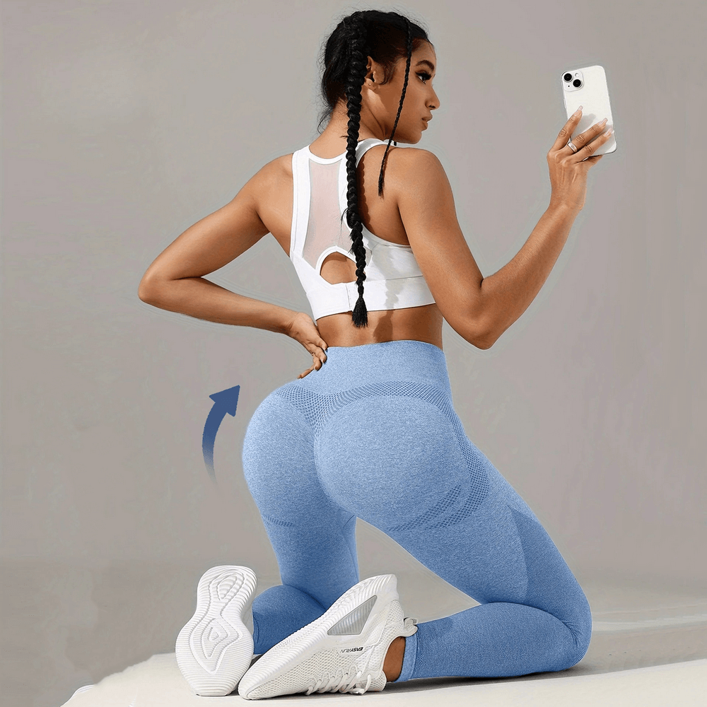 Woman wearing Women's Seamless Booty Lift Gym Leggings - SF4059 in blue, showcasing fit and style for active lifestyle.