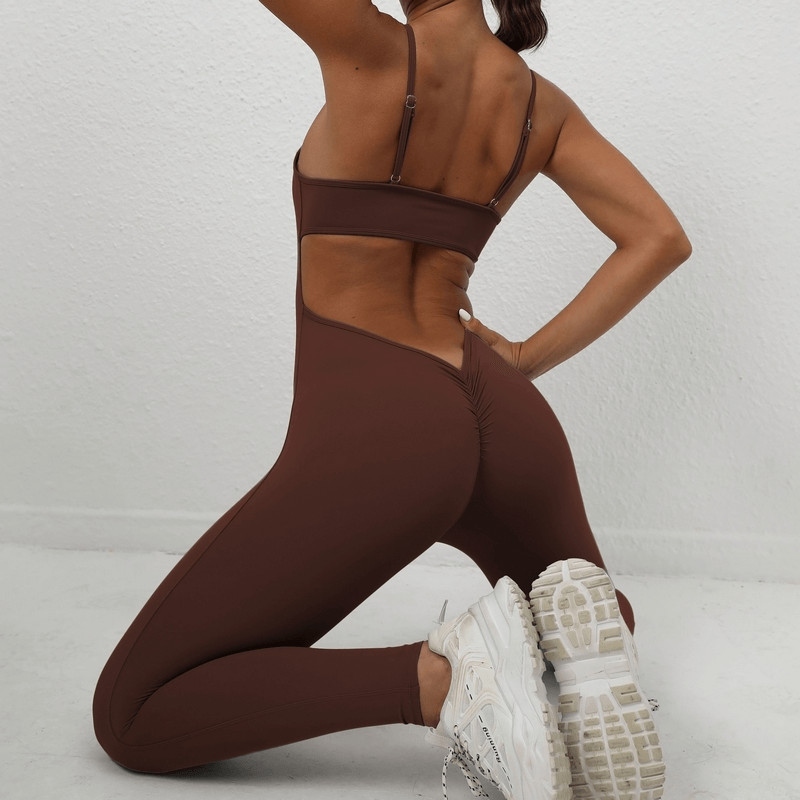 Back view of a woman wearing a brown seamless fitness jumpsuit with sexy back and straps, perfect for exercise and comfort.
