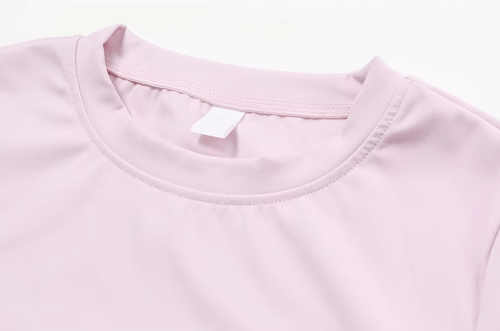 Pink women's seamless short-sleeve yoga T-shirt made from nylon and spandex, perfect for gym, fitness, cycling, and hiking.