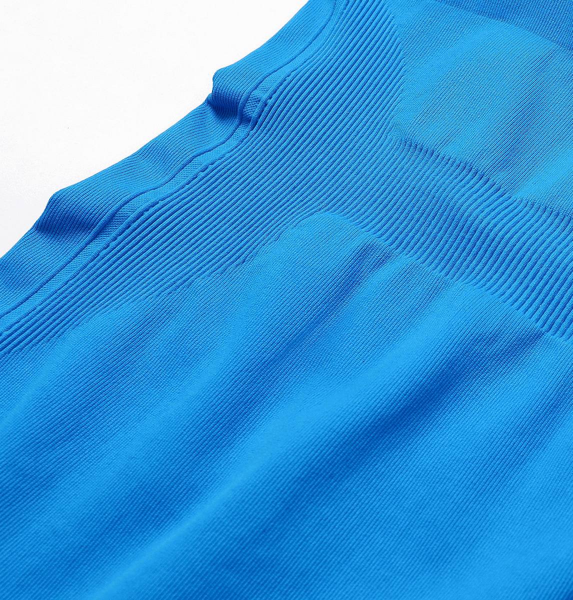Close-up of blue sleeveless cotton jumpsuit with ribbed detailing and smooth texture, ideal for yoga and fitness activities.