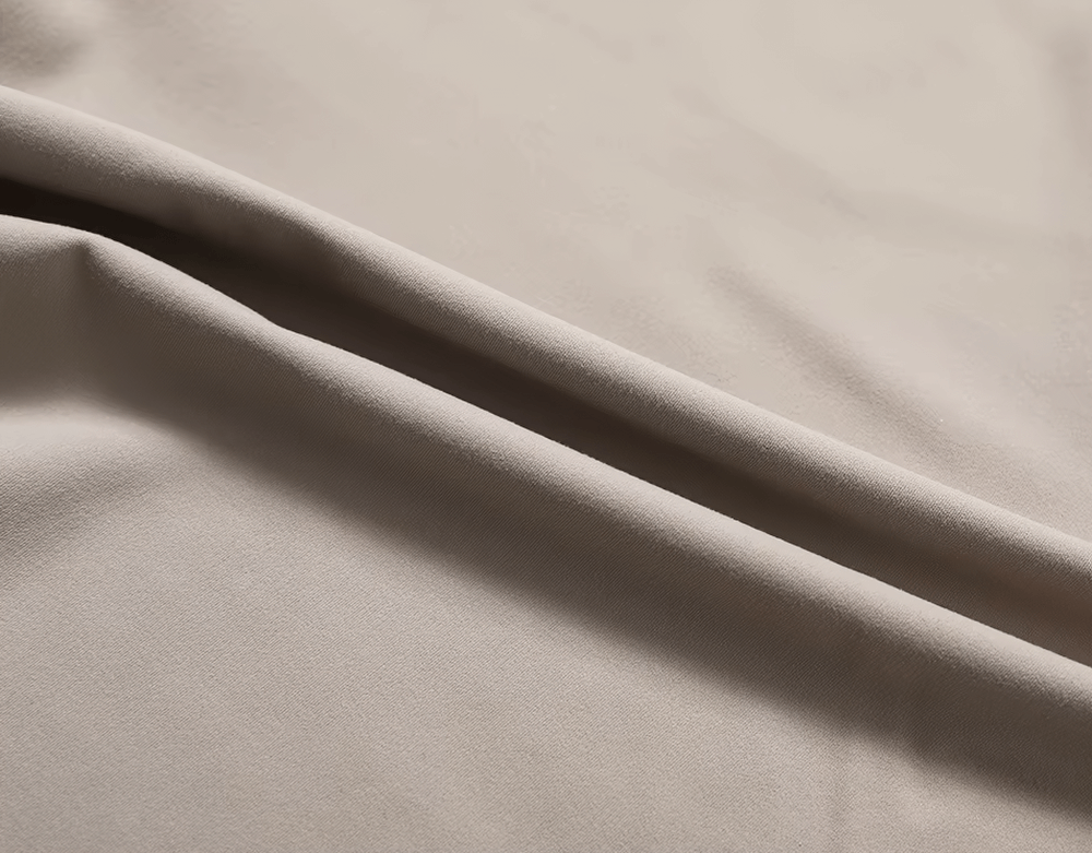 Close-up of breathable nylon-spandex fabric for women's fitness T-shirt, showcasing its smooth and wrinkle-resistant texture.