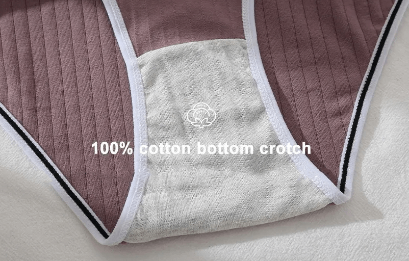 Close-up of women's cotton panties showing 100% cotton crotch in soft mauve with white trim, emphasizing comfort and breathability.