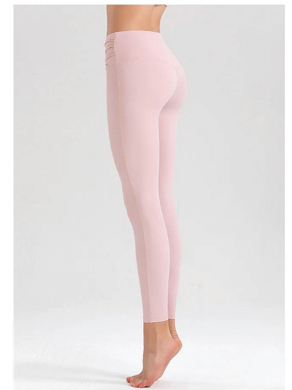 Side view of pink spandex leggings showcasing their sleek fit and breathable fabric, perfect for workouts.