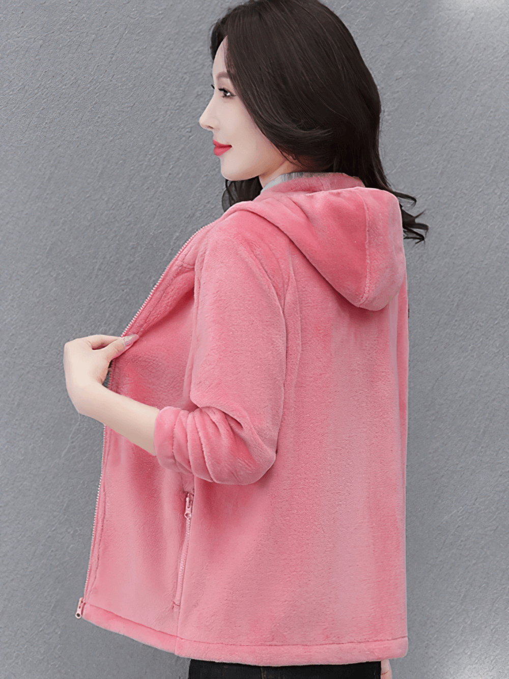 Woman wearing Women's Sports Hooded Fleece Jacket for Outdoor - SF4104 in pink, ideal for winter activities, showing side view with hood.