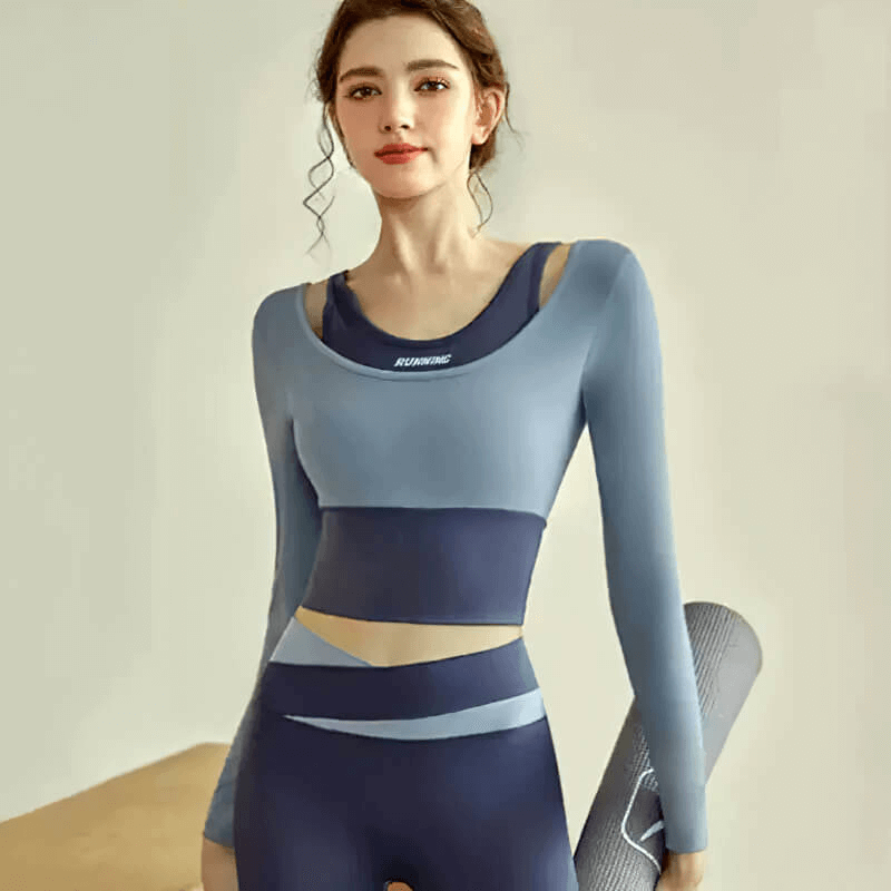 Woman wearing a sports long sleeves crop top, ideal for fitness training; anti-pilling, quick-dry, breathable fabric; female athlete look.