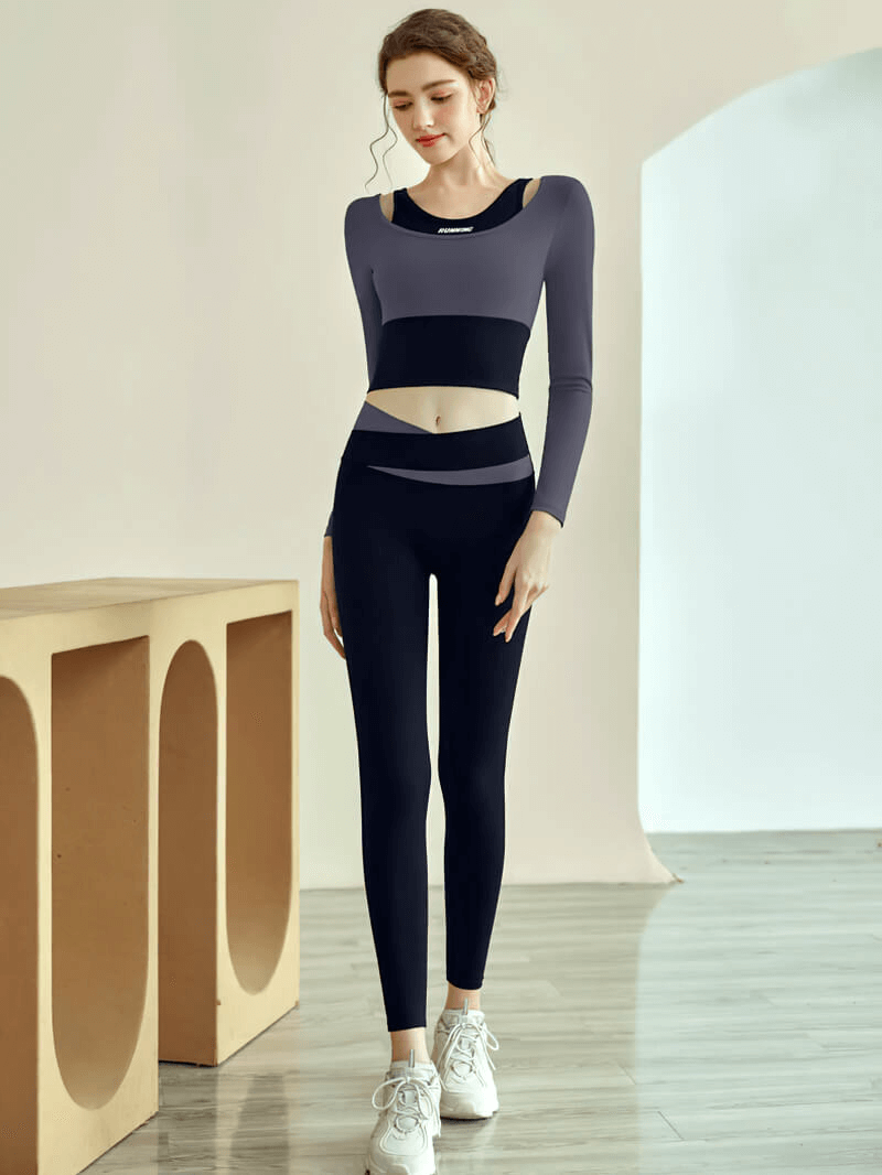 Woman wearing a stylish women's sports long sleeves crop top for fitness training, with a sleek design and comfortable fit.