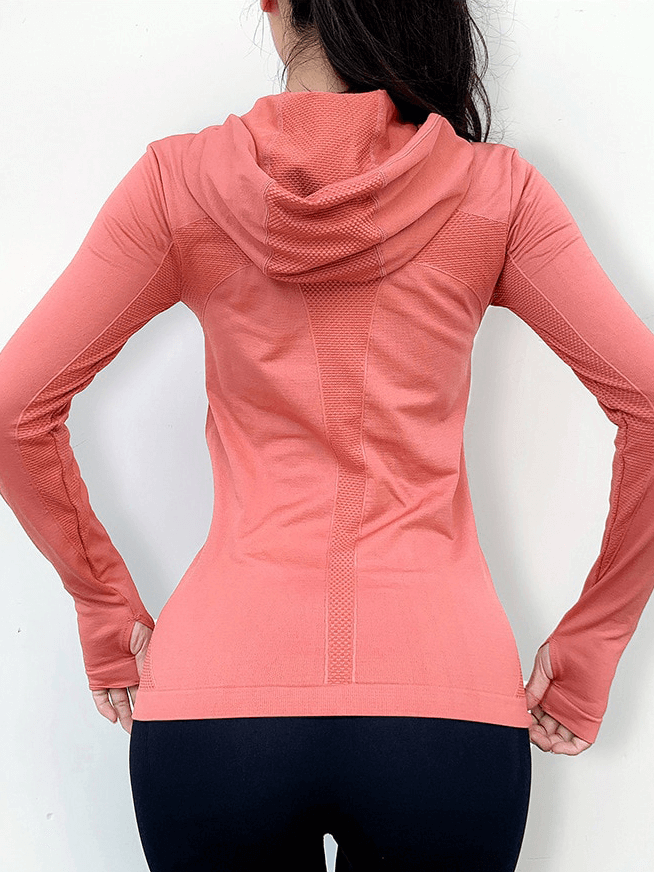 Back view of woman wearing a pink women's sports zipper hoodie with thumb holes, ideal for yoga and fitness - SF1346