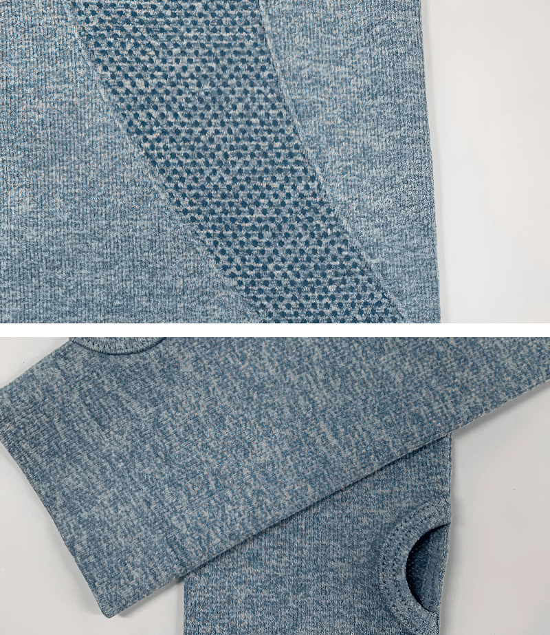 Close-up of blue women's sports zipper hoodie fabric and thumb hole sleeve, featuring breathable quick-dry material with a solid pattern.