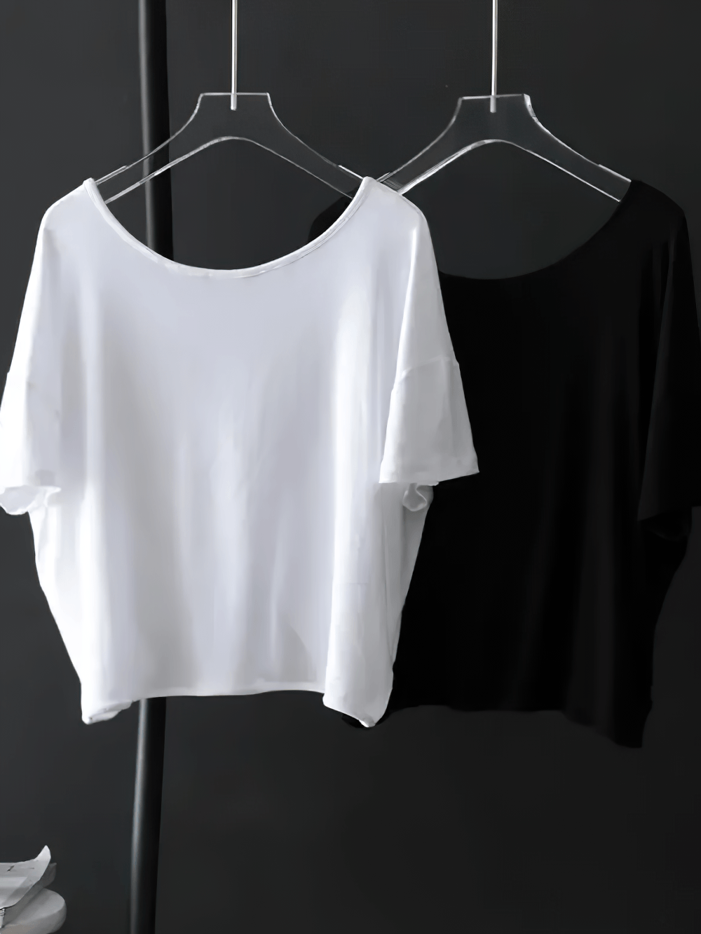 Alt Tag: Women's Sporty O-Neck Loose Asymmetrical T-Shirt - SF4454 in white and black, lightweight draped short-sleeve tops on hangers