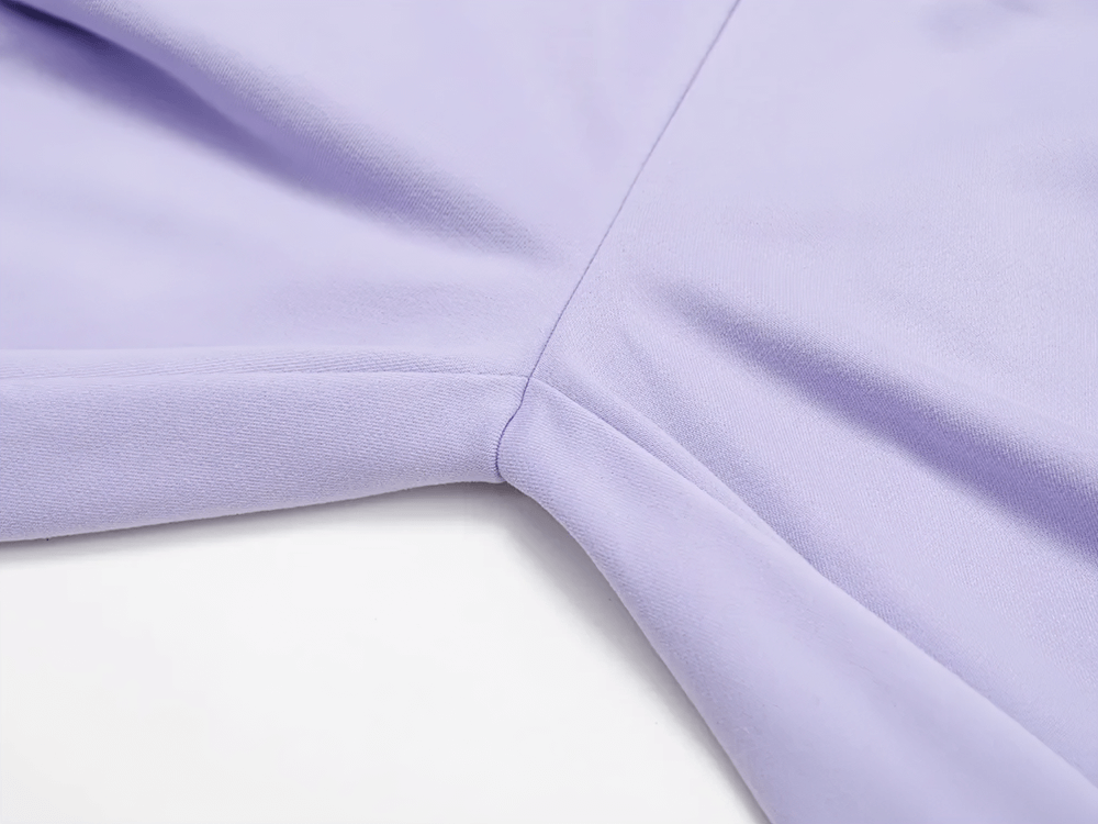 Close-up of a lavender high-waist straight-leg sweatpant, highlighting the soft fabric and seam detail for women.